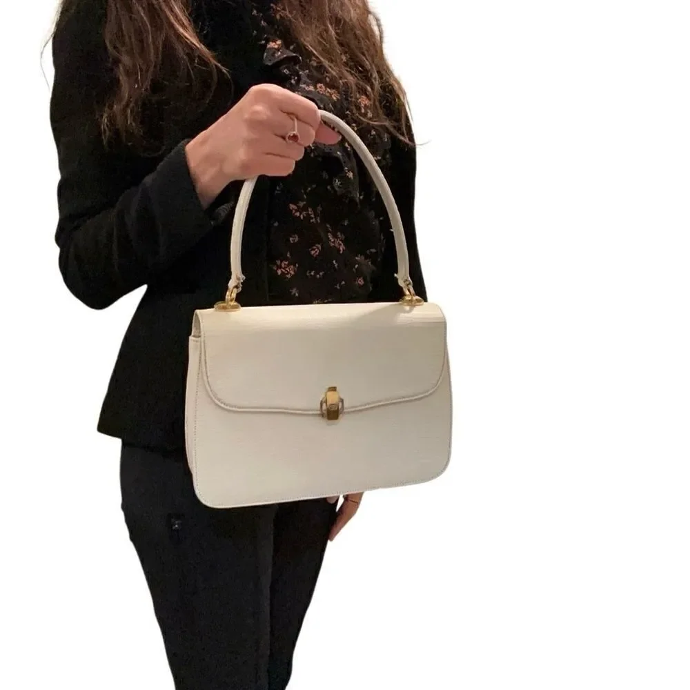 Gucci lizard embossed leather top handle tote